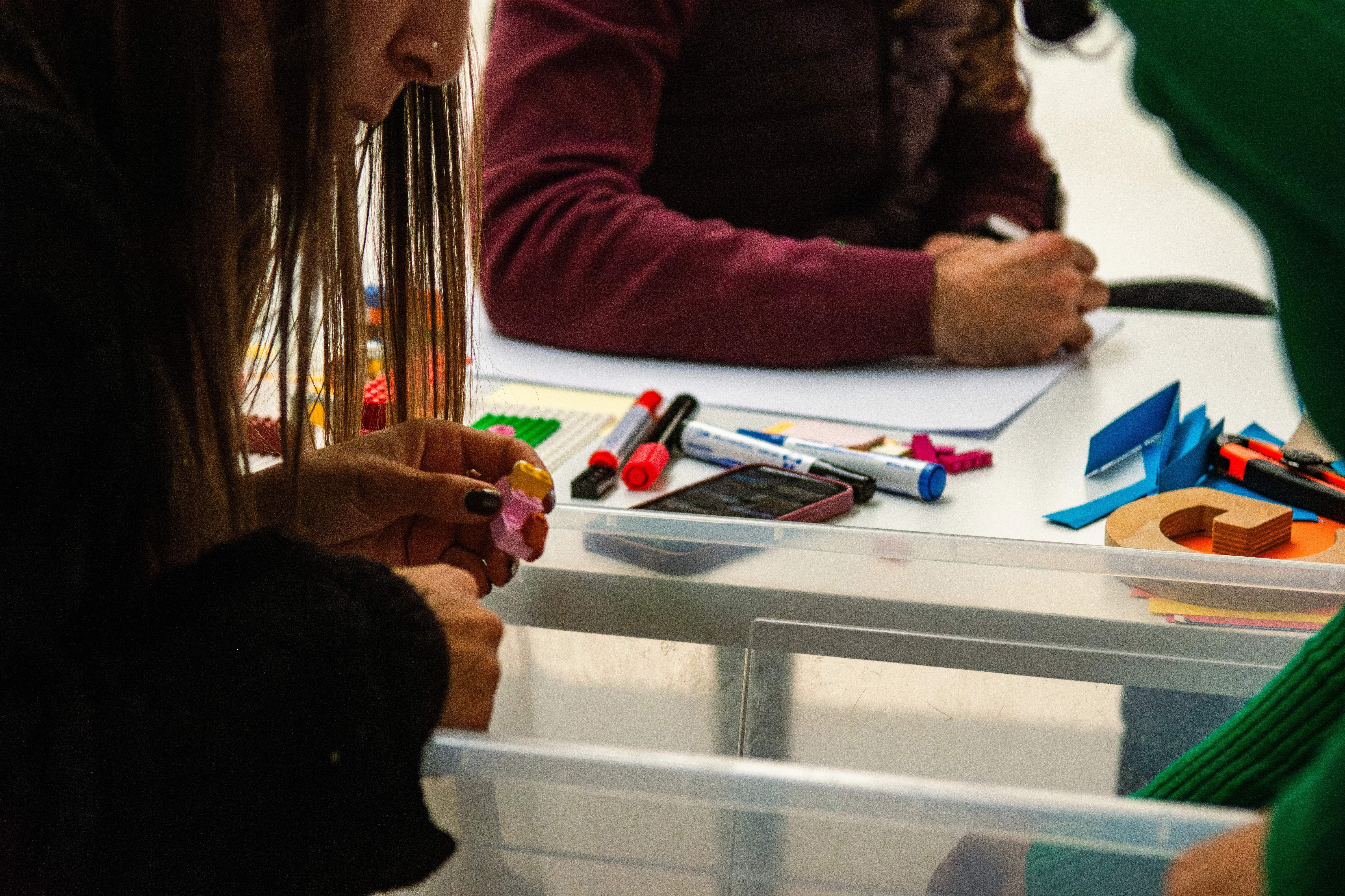 People writing and using Lego pieces to prototype ideas
